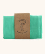 Laura's 100% organic cotton small play cloth in green held together by a decorated cardboard strip