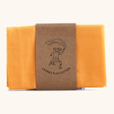 Laura's 100% organic cotton small play cloth in orange held together by a decorated cardboard strip
