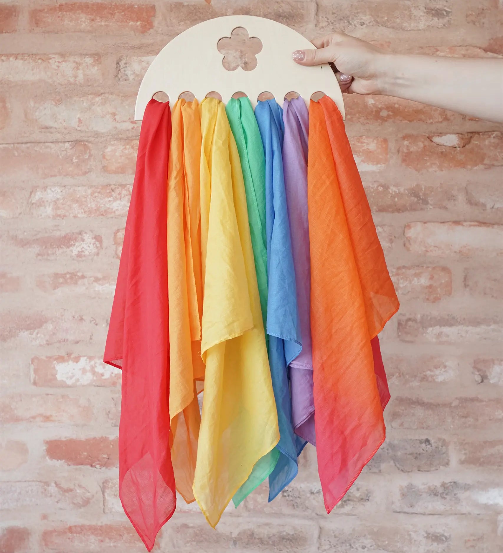 Laura's Play Cotton large Wooden Display holder with flower cut out with 7 play cloths inside.