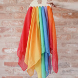 Laura's Play Cotton small Wooden Display holder with flower cut out with 7 play cloths inside.