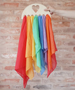 Laura's Play Cotton large Wooden Display holder with heart cut out with 7 play cloths inside.