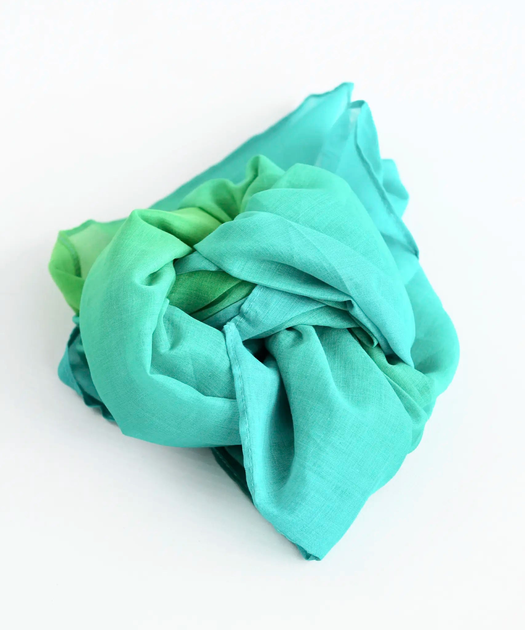 Laura's play cotton woods green gradient playcloth, made from 100% organic cotton ruffled up into a pile