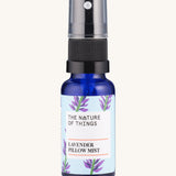 Lavender Sleep Pillow Mist pure essential oil in a blue glass bottle with a spray cap.
