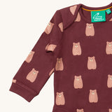 A close up of the brown bear Little Green Radicals baby body suit showing the dark maroon trim and cute brown bear print on soft organic cotton fabric