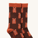 A close up of the teddy bear Little Green Radicals ankle socks showing teddy bear design with light brown ankle and heel trim on soft organic cotton fabric