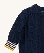 A close up of the Little Green Radicals navy aran knitted jumper available at Babipur. Showing the cable knit and the thick collar detail on dark navy organic cotton fabric