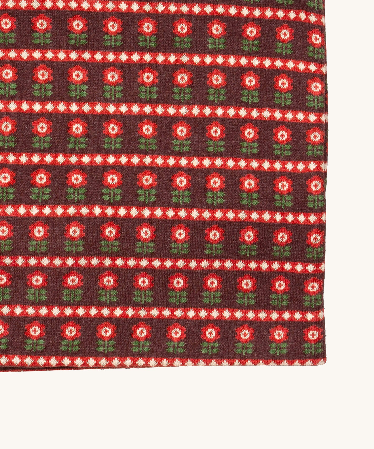 A close up of the Little Green Radicals baby blanket in collecting birds. Showing the design detail on brown organic cotton fabric.