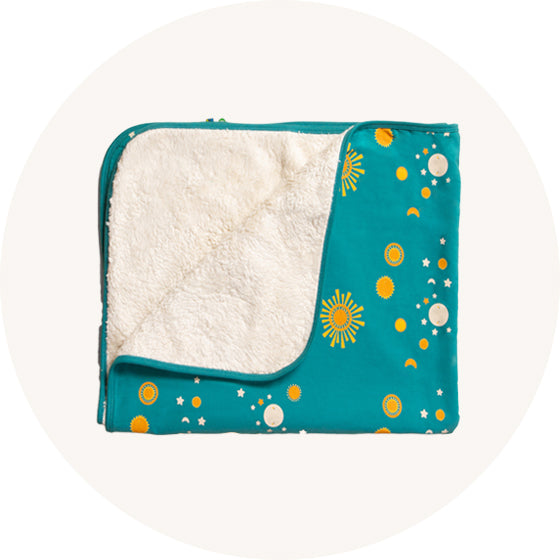 Little Green Radcials sherpa blanket on cream background to represent Little Green Radicals bedding range at Babipur.