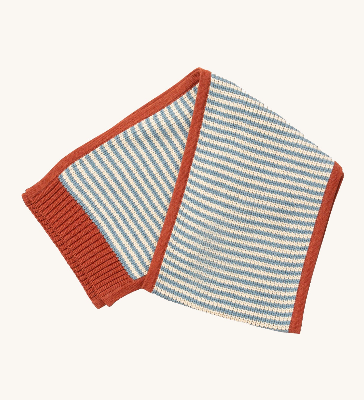Little Green Radicals knitted scarf in blue stripes available at Babipur. A thick knitted GOTS organic cotton scarf in blue and cream stripes with a red trim