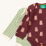 A close up of the brown bear Little Green Radicals baby body suit on top of the striped bodysuit showing collar trim and print detail on soft organic cotton fabric