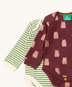 A close up of the brown bear Little Green Radicals baby body suit on top of the striped bodysuit showing collar trim and print detail on soft organic cotton fabric