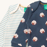 A close up of the sheep Little Green Radicals baby body suit on top of the striped bodysuit showing collar detail and print detail on navy soft organic cotton fabric