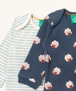 A close up of the sheep Little Green Radicals baby body suit on top of the striped bodysuit showing collar detail and print detail on navy soft organic cotton fabric