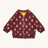 Little Green Radicals reversible easy rider jacket in brown bears. A GOTS organic cotton bomber jacket style in brown with a full length zip, pouch pockets and cute prints of brown bears. Features a yellow and white stripe reversible side