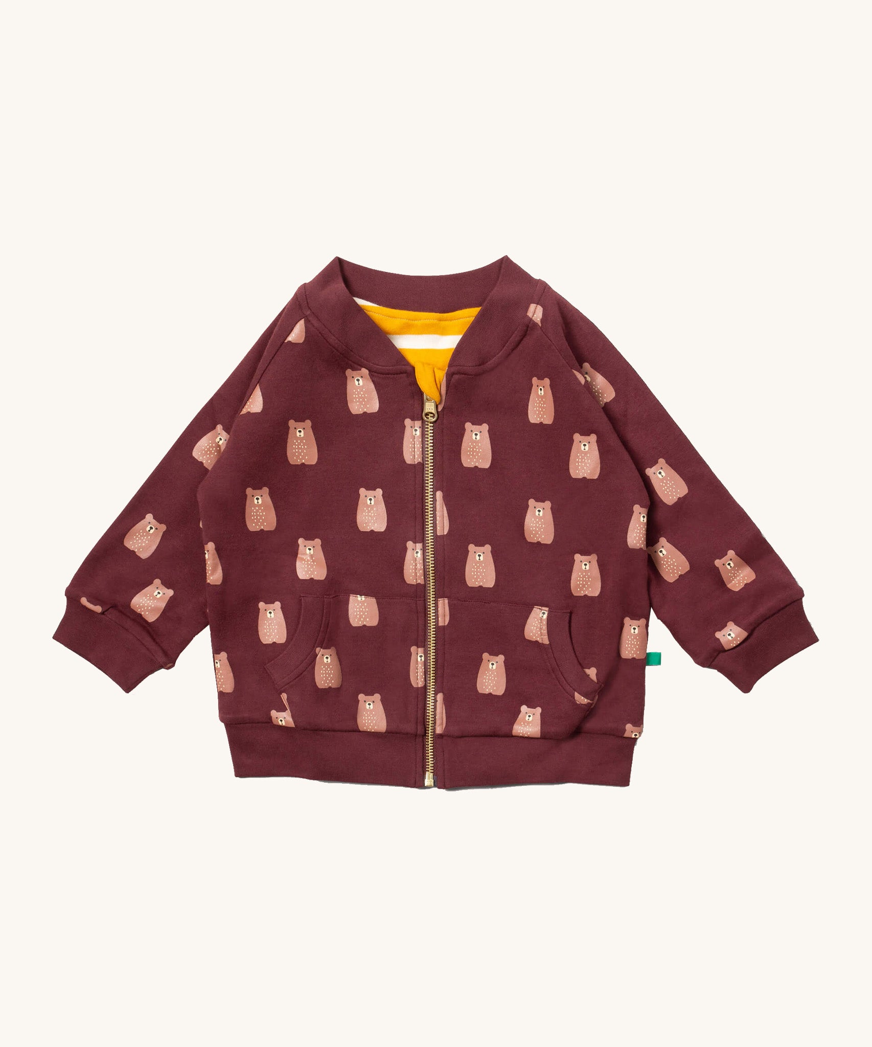 Little Green Radicals reversible easy rider jacket in brown bears. A GOTS organic cotton bomber jacket style in brown with a full length zip, pouch pockets and cute prints of brown bears. Features a yellow and white stripe reversible side