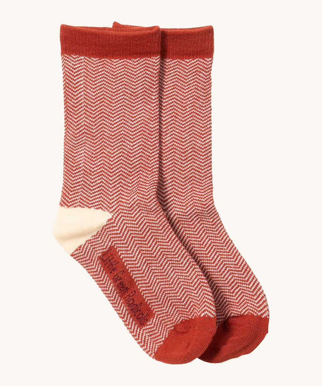 Little Green Radicals striped ankle socks available at Babipur. A red and cream GOTS organic cotton sock with a zig zag  design and red trim.