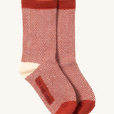 Little Green Radicals striped ankle socks available at Babipur. A red and cream GOTS organic cotton sock with a zig zag  design and red trim.