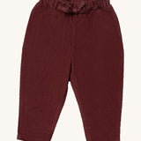 Little Green Radicals comfy trousers in chocolate corduroy available at Babipur.. A soft GOTS organic cotton trousers in dark maroon with elasticated waistband for a comfortable fit and a matching drawstring.