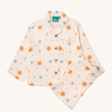 Little Green Radicals classic pyjama set in moon and sun available at Babipur. A GOTS organic cotton pyjama set including a long sleeve shirt style top in light pink with prints of cute birds flying through stars the moon and sun also includes matching bottoms