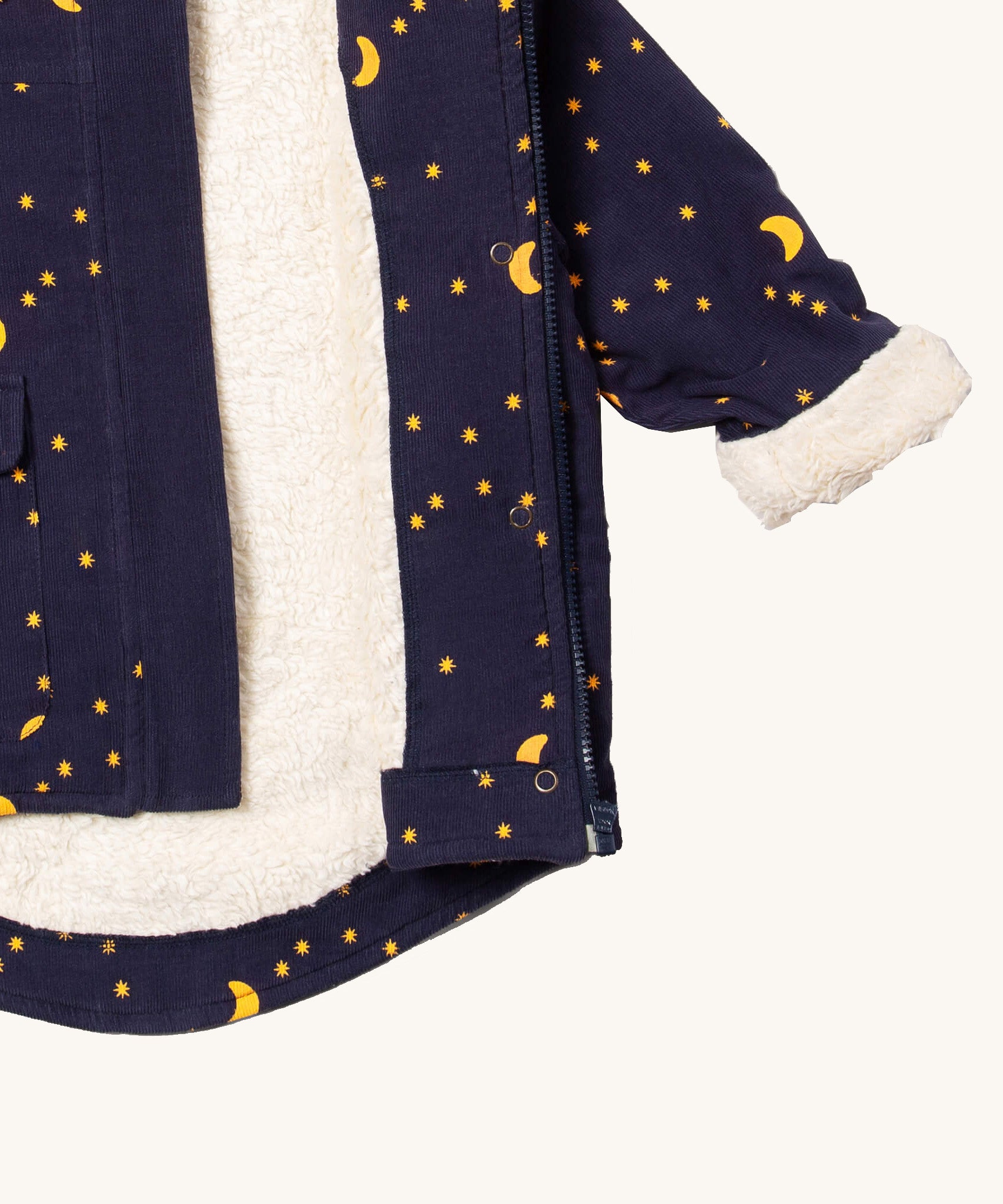 A close up of the Little Green Radicals dark night sherpa toasty coat available at  Babipur. Showing the white sherpa fleece inner liner and full length zip detail