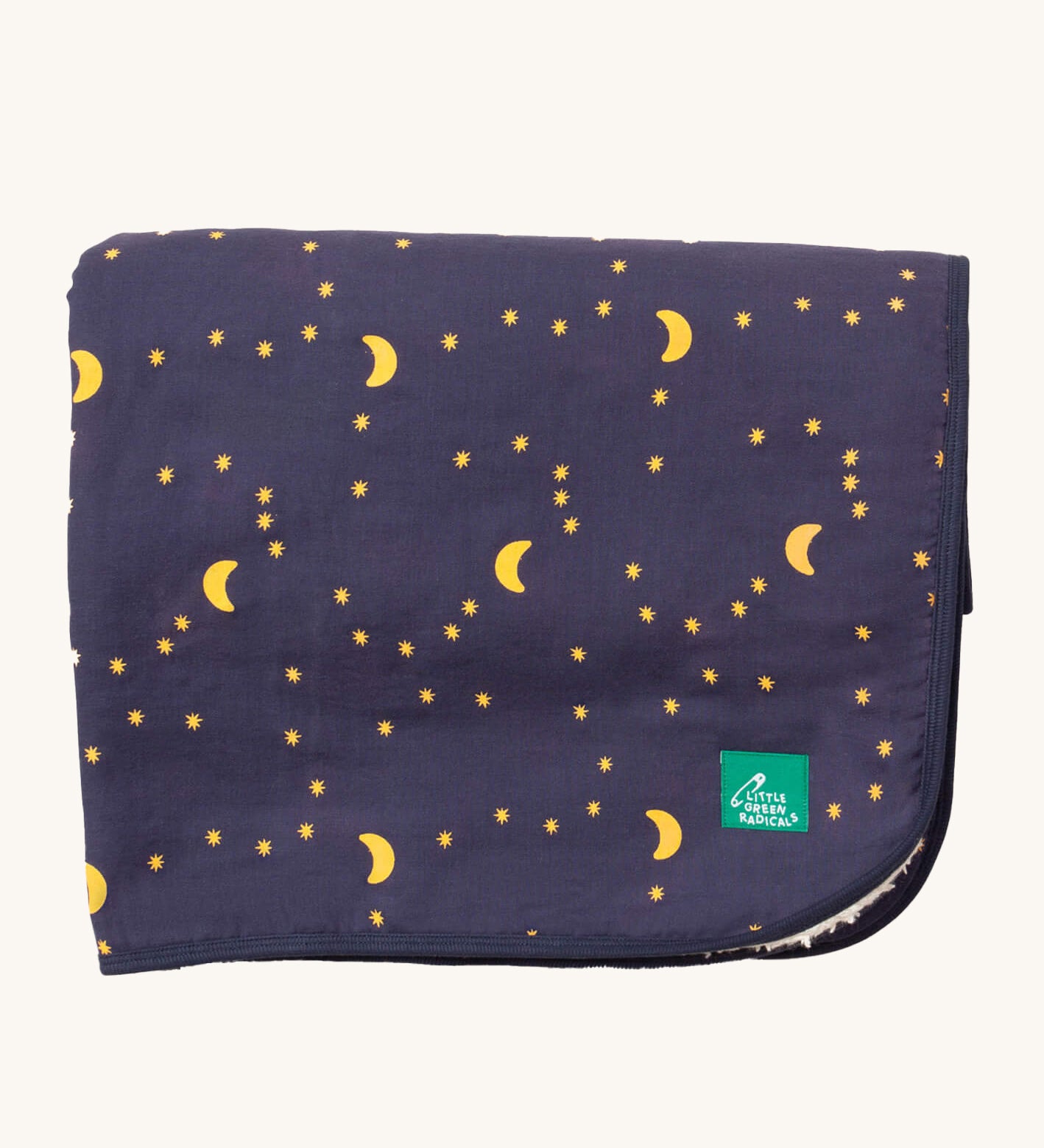 Little Green Radicals dark night sherpa hooded blanket. A GOTS organic cotton navy blanket with a starry night print and a brand logo patch on the corner. Features a white sherpa style fleece lining.