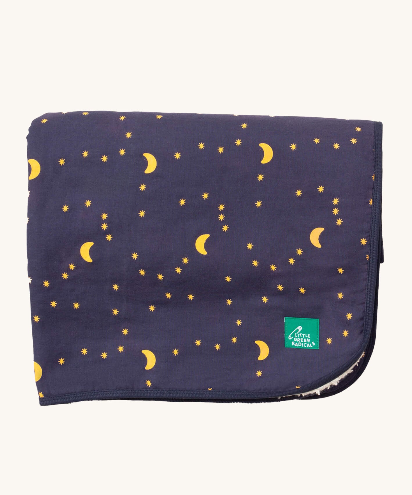 Little Green Radicals dark night sherpa hooded blanket. A GOTS organic cotton navy blanket with a starry night print and a brand logo patch on the corner. Features a white sherpa style fleece lining.