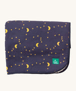 Little Green Radicals dark night sherpa hooded blanket. A GOTS organic cotton navy blanket with a starry night print and a brand logo patch on the corner. Features a white sherpa style fleece lining.