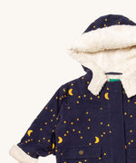 A close up of the Little Green Radicals dark night sherpa toasty coat. Showing the white sherpa style fleece inner,  matching trim for extra warmth and corduroy detail on GOTS organic cotton fabric. 