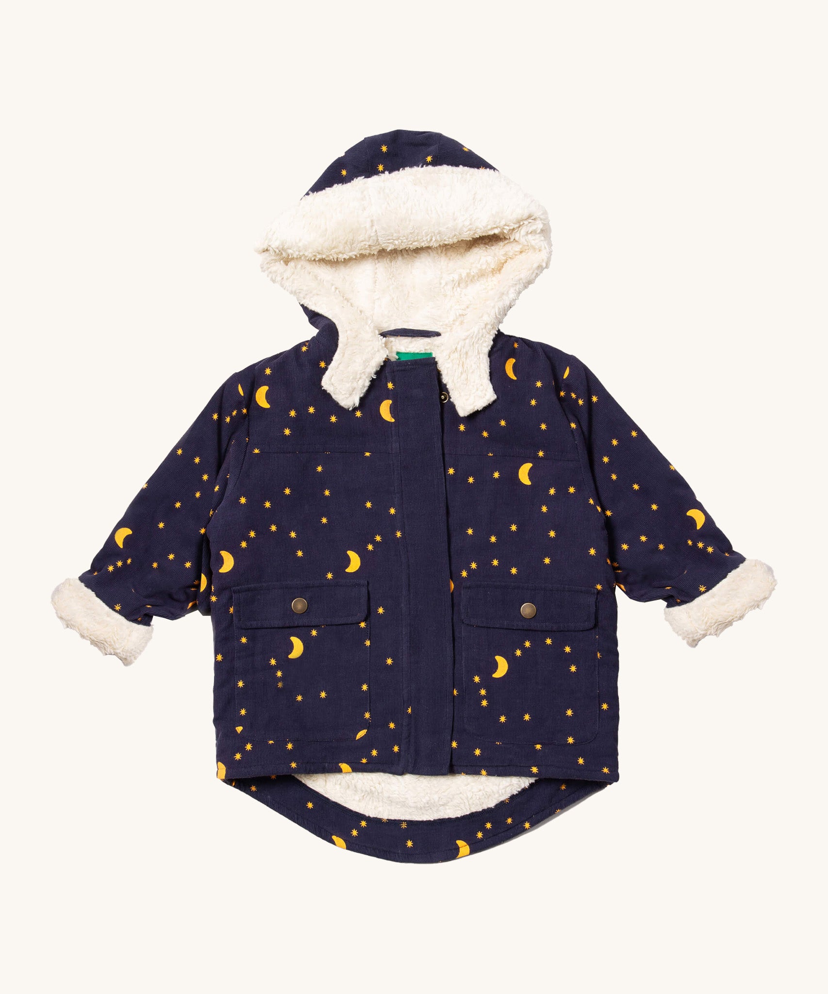 Little Green Radicals dark night sherpa toasty coat available at  Babipur. A GOTS organic cotton winter corduroy style jacket  in navy with a white fleece inner for warmth. Features 2 side pockets with popper fasteners and a delicate starry night design