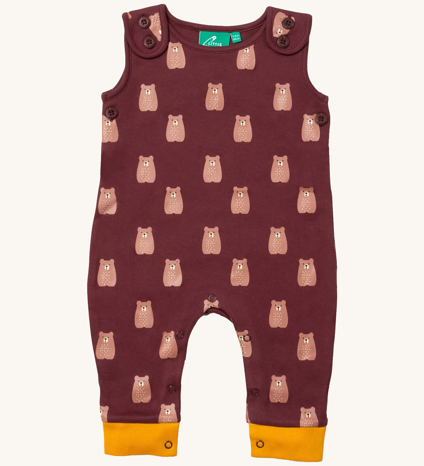 Little green Radicals brown bears everyday dungarees available at Babipur. A GOTS organic cotton dungaree in dark maroon and yellow trim with prints of cute brown bears. Features button fasteners on the shoulder and popper around the crotch.