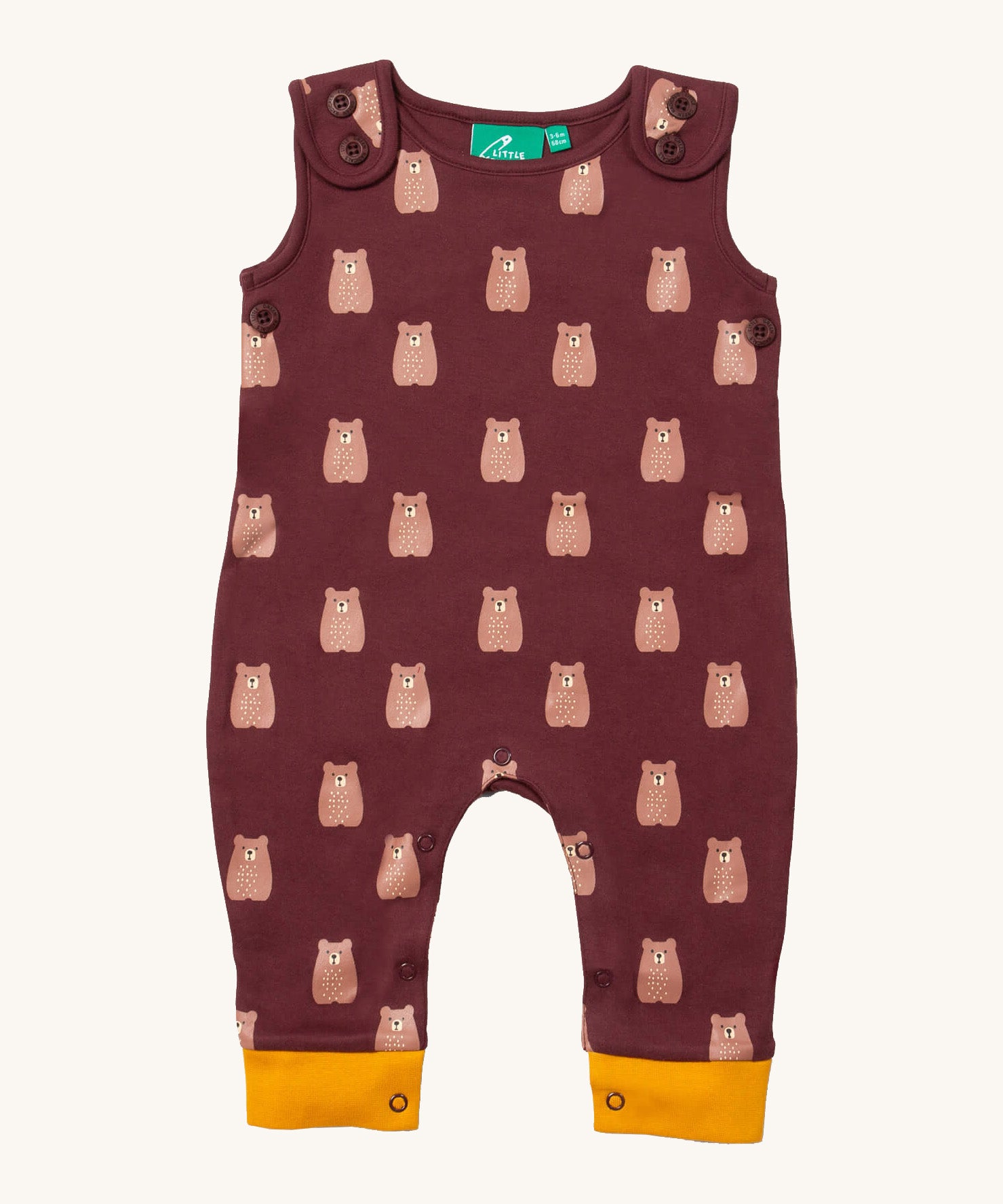 Little green Radicals brown bears everyday dungarees available at Babipur. A GOTS organic cotton dungaree in dark maroon and yellow trim with prints of cute brown bears. Features button fasteners on the shoulder and popper around the crotch.