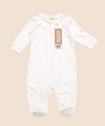 Little Green Radicals footed babygrow in white from the Hello World gift set. A organic cotton long sleeve all in one with full length poppers around the legs and crotch for easy fitting
