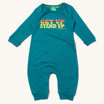 Little Green Radicals Get Up Stand Up Organic Cotton Playsuit in a turquoise coloured fabric, with orange, yellow and green lettering on a cream background