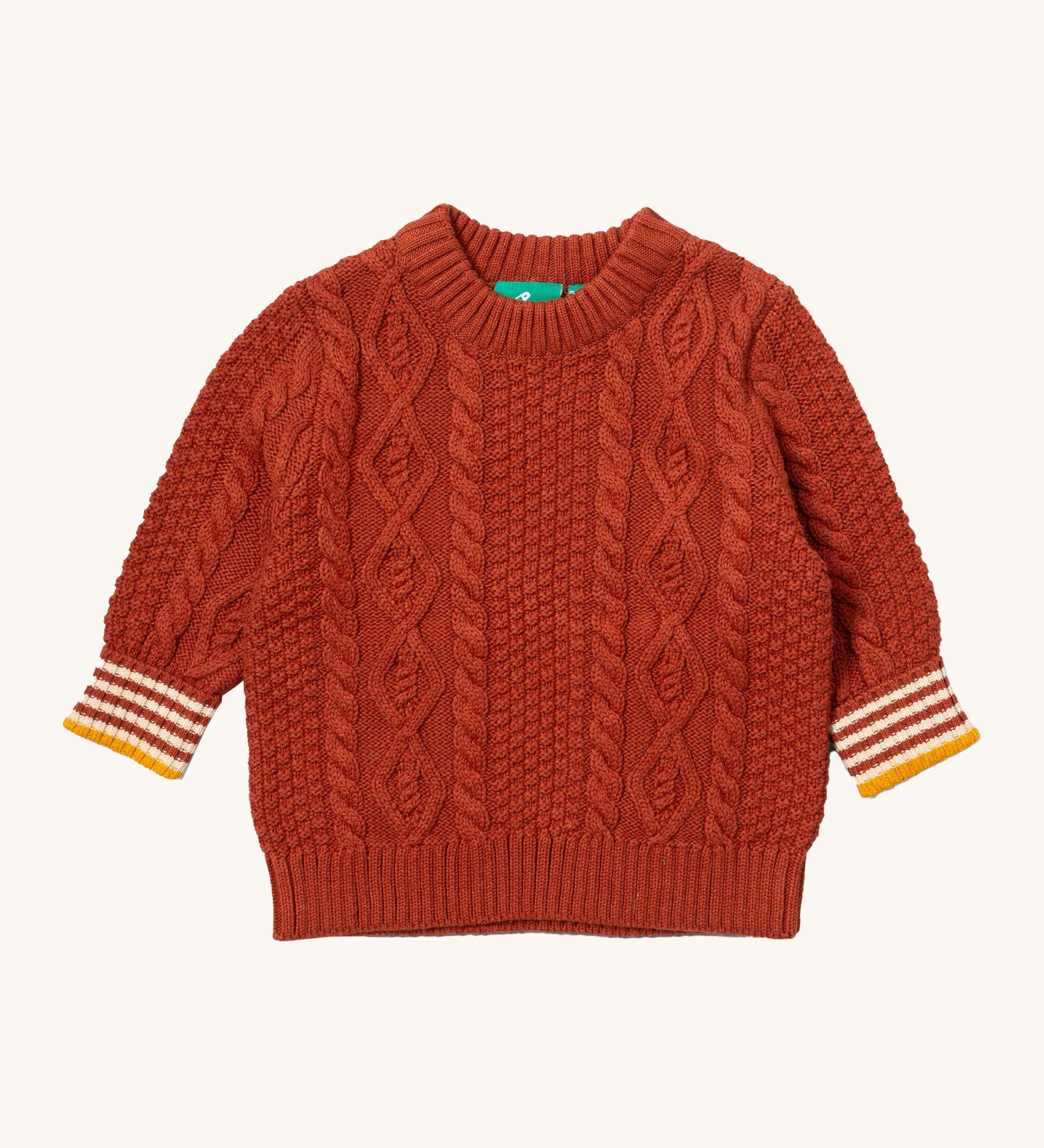 Little Green Radicals ginger aran knitted jumper available at Babipur. A GOTS organic cotton jumper in dark orange with a thick cable knit on the body and a striped design on the cuffs.