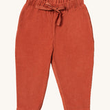 Little Green Radicals comfy trousers in ginger corduroy available at Babipur. A soft GOTS organic cotton trousers in dark orange with elasticated waistband for a comfortable fit and a matching drawstring.