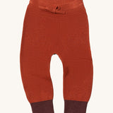 Little Green Radicals ginger knitted leggings available at Babipur. A soft GOTS knitted style leggings in dark orange with contrast trim. Features an elasticated band with drawstring. 