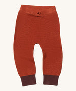 Little Green Radicals ginger knitted leggings available at Babipur. A soft GOTS knitted style leggings in dark orange with contrast trim. Features an elasticated band with drawstring. 