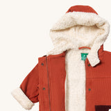 Little Green Radicals ginger sherpa toasty coat available at  Babipur. A GOTS organic cotton winter corduroy style jacket  in dark orange with a white fleece inner for warmth. Features a full length zip and popper fasteners for a secure fit.