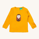 Little Green Radicals gold brown owl applique long sleeve top available at Babipur. A GOTS organic cotton top in yellow with a cute brown applique on the front. Features popper fasteners on the back.