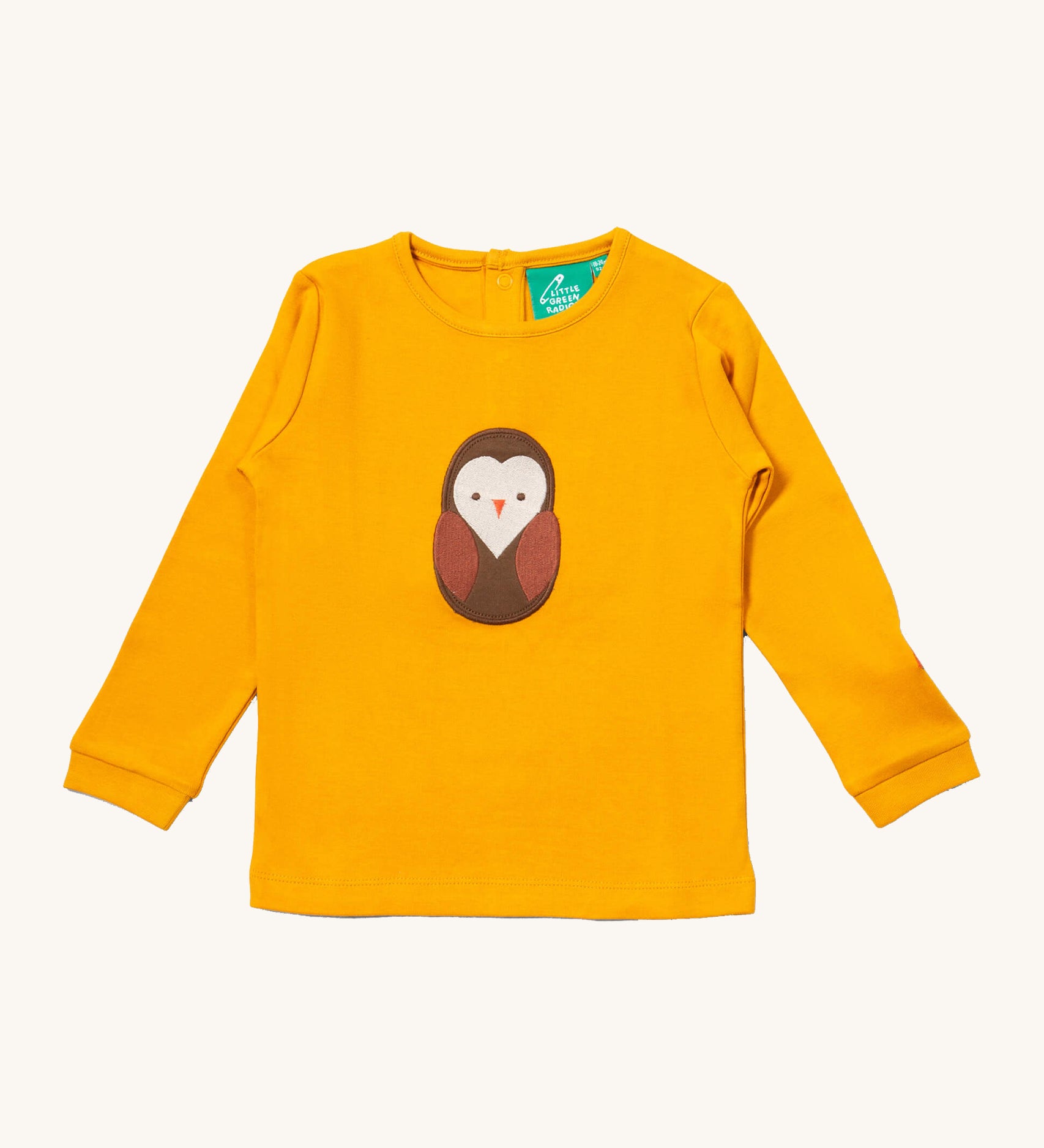 Little Green Radicals gold brown owl applique long sleeve top available at Babipur. A GOTS organic cotton top in yellow with a cute brown applique on the front. Features popper fasteners on the back.