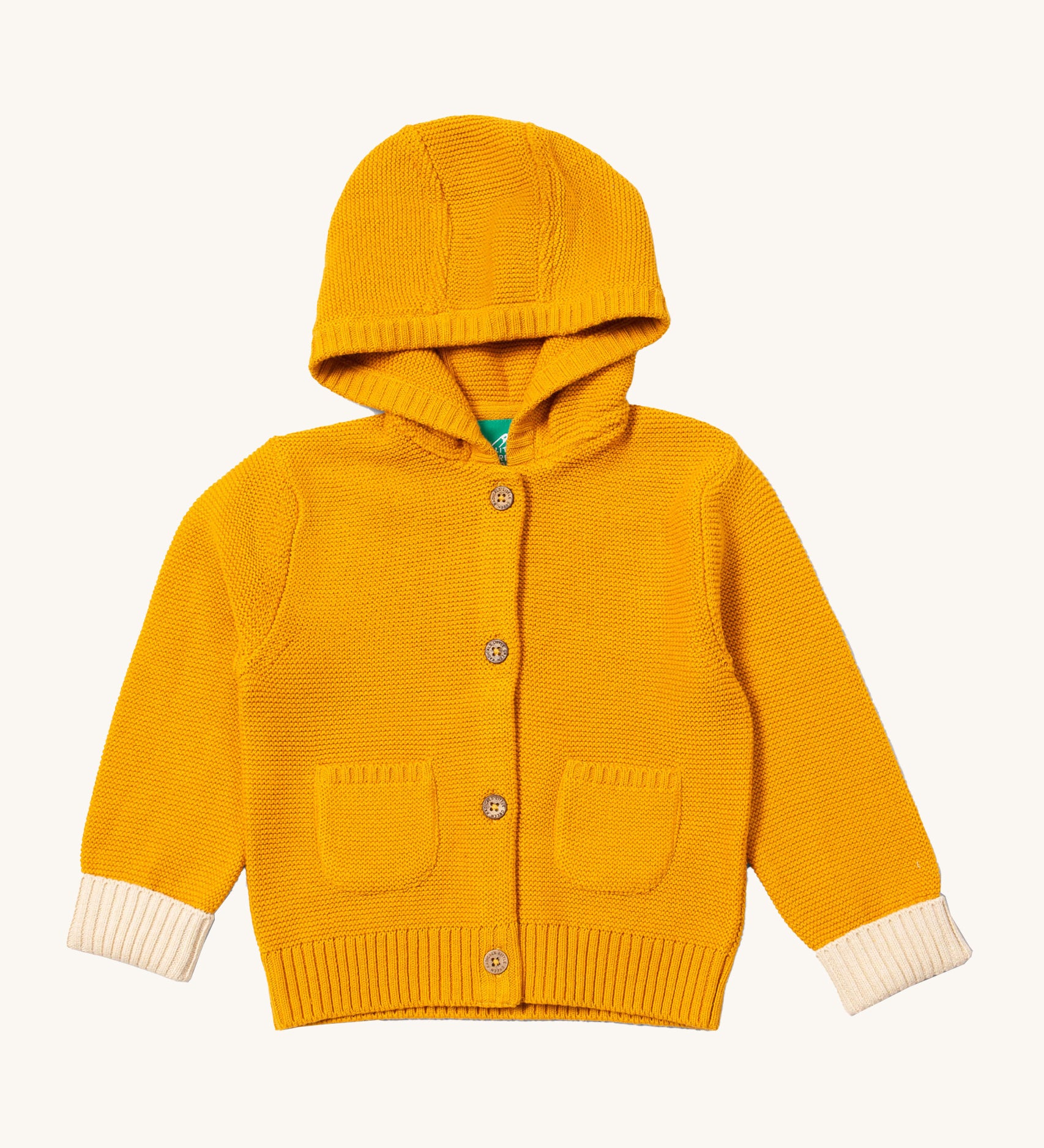 Little Green Radicals gold snuggly hooded knitted cardigan available at Babipur. A GOTS organic cotton warm cardigan in yellow with a cream cuff trim. Features a hood, 2 pouch pockets and button fasteners down the middle