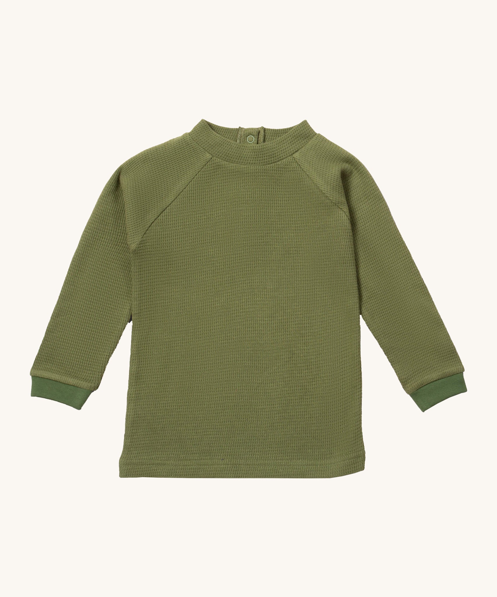 Little Green Radicals green chive waffle long sleeve cosy top available at Babipur. A GOTS organic cotton top in dark green, features popper fasteners on the back