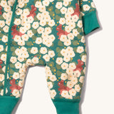A close up of the Little Green Radicals sherpa line snow suit in hedgerow. Showing the teal trim detail and a close up of the squirrel print on GOTS organic cotton fabric