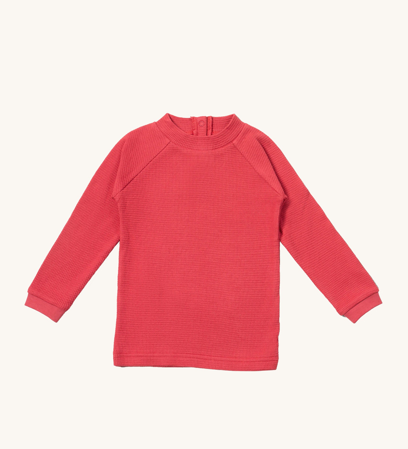 Little Green Radicals pink berry waffle long sleeve cosy top available at Babipur. A GOTS organic cotton top in dark pink, features popper fasteners on the back