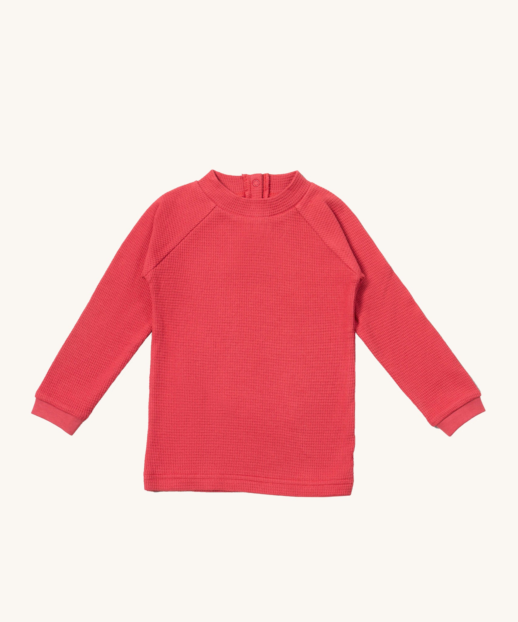Little Green Radicals pink berry waffle long sleeve cosy top available at Babipur. A GOTS organic cotton top in dark pink, features popper fasteners on the back