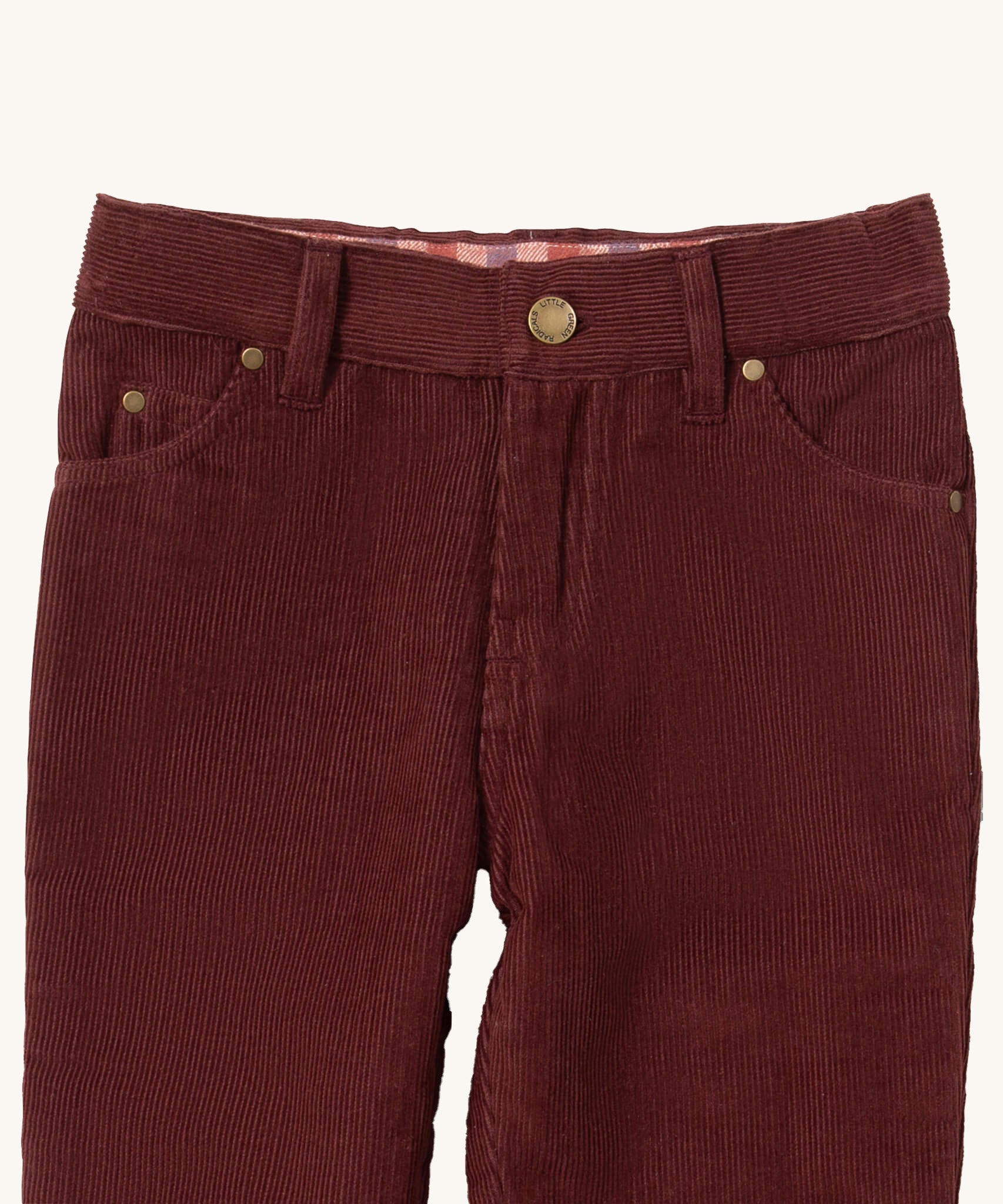 A close up of the Little Green Radicals adventure jeans in chocolate corduroy. Showing the pocket and button clip detail on dark maroon soft GOTS organic cotton fabric