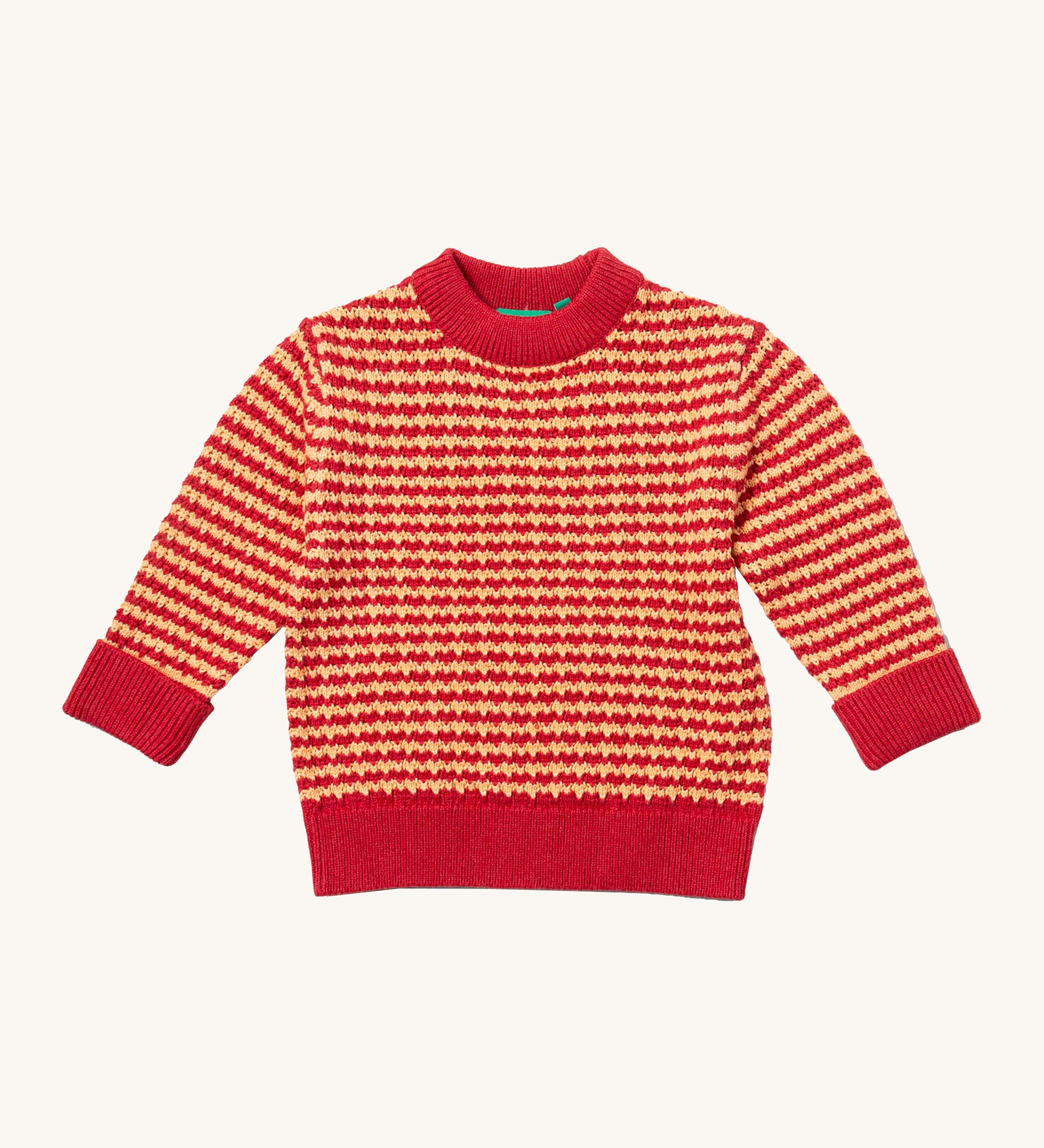 Little Green Radicals snuggly knitted jumper in juniper stripe available at Babipur. A thick warm knitted jumper from GOTS organic cotton fabric in pale red and yellow stripe with a pale collar, cuff and hem trim. 