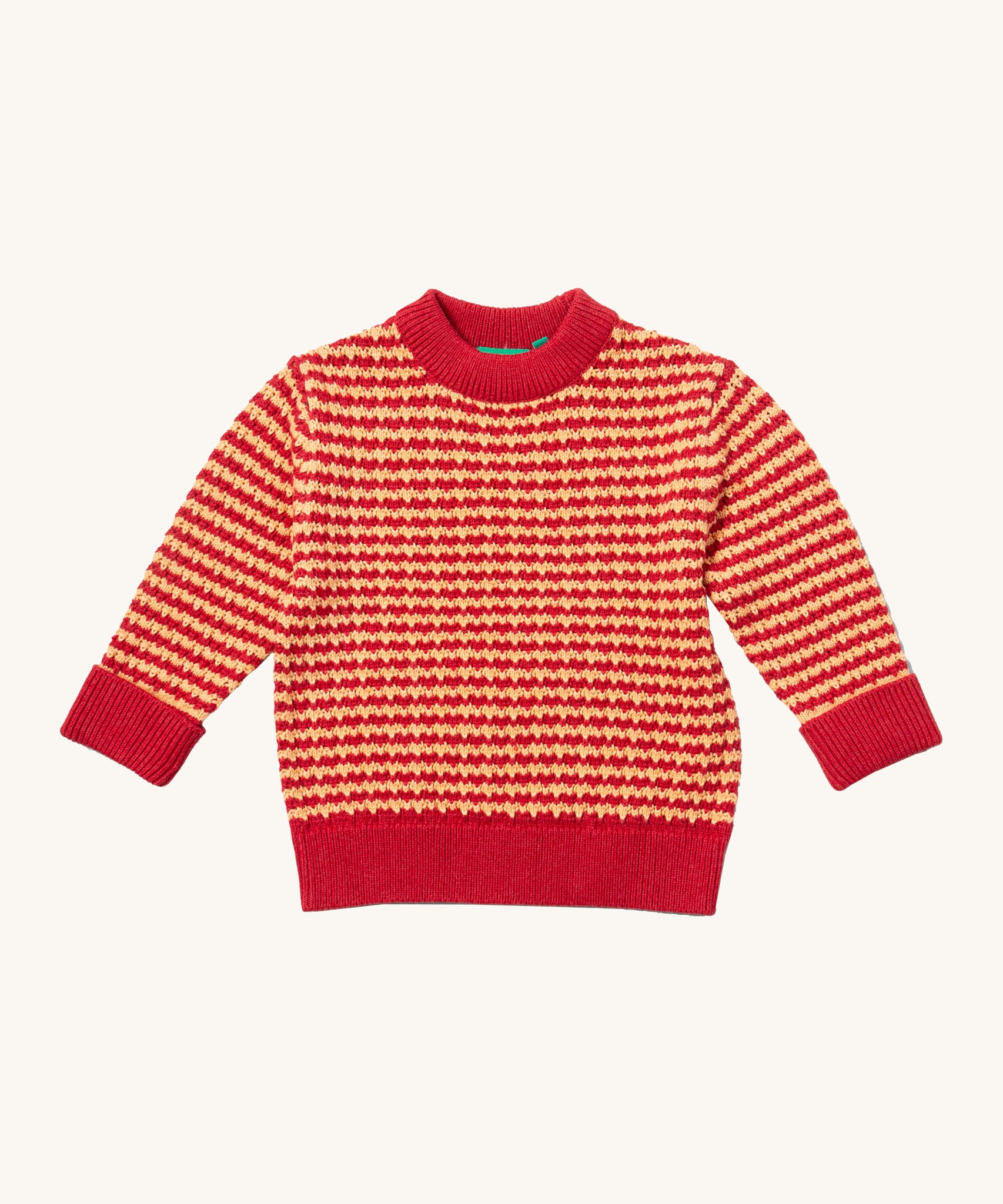 Little Green Radicals snuggly knitted jumper in juniper stripe available at Babipur. A thick warm knitted jumper from GOTS organic cotton fabric in pale red and yellow stripe with a pale collar, cuff and hem trim. 