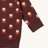 A close up of the  Little Green Radicals brown owl knitted jumper available at Babipur. Showing the cuff and hem detail on brown organic cotton fabric