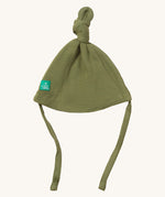 Little Green Radicals chive tie hat available at Babipur. A GOTS organic cotton hat in green with a knot on the top. Features a small brand patch on the brim and matching green ties for a secure fit.
